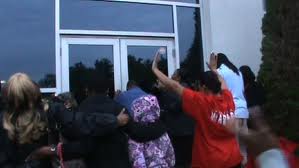 members praying outside